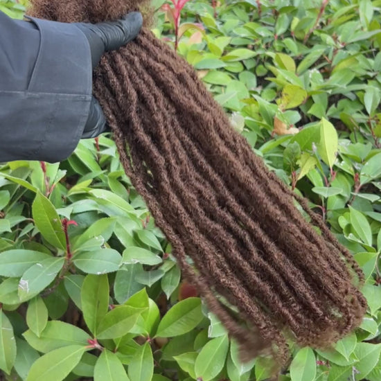 medium brown textured loc extensions with curly ends video